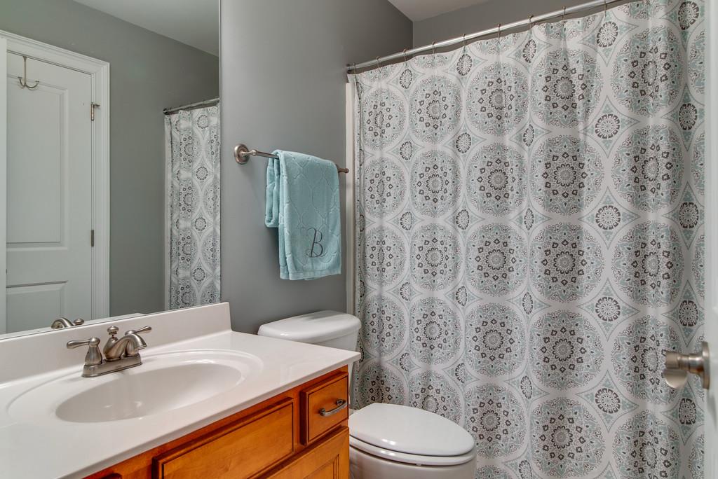 1219 White Rock Road Spring Hill, TN 37174 - Photo 22 of 30 a bathroom with a sink toilet and shower
