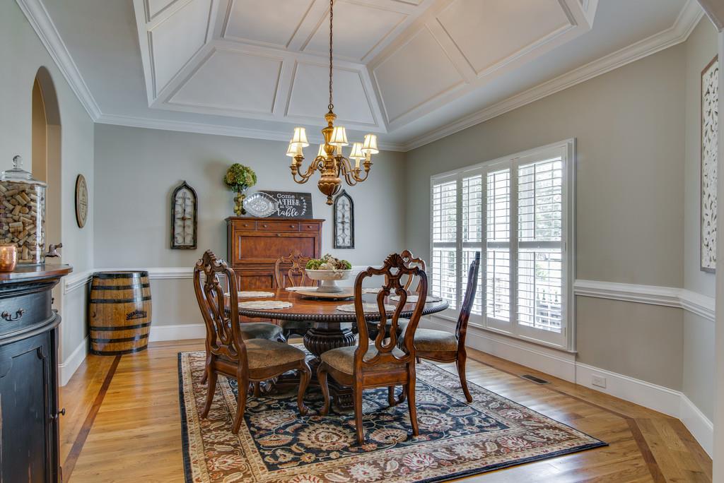 1219 White Rock Road Spring Hill, TN 37174 - Photo 6 of 30 a view of a dining room with furniture a chandelier and wooden floor