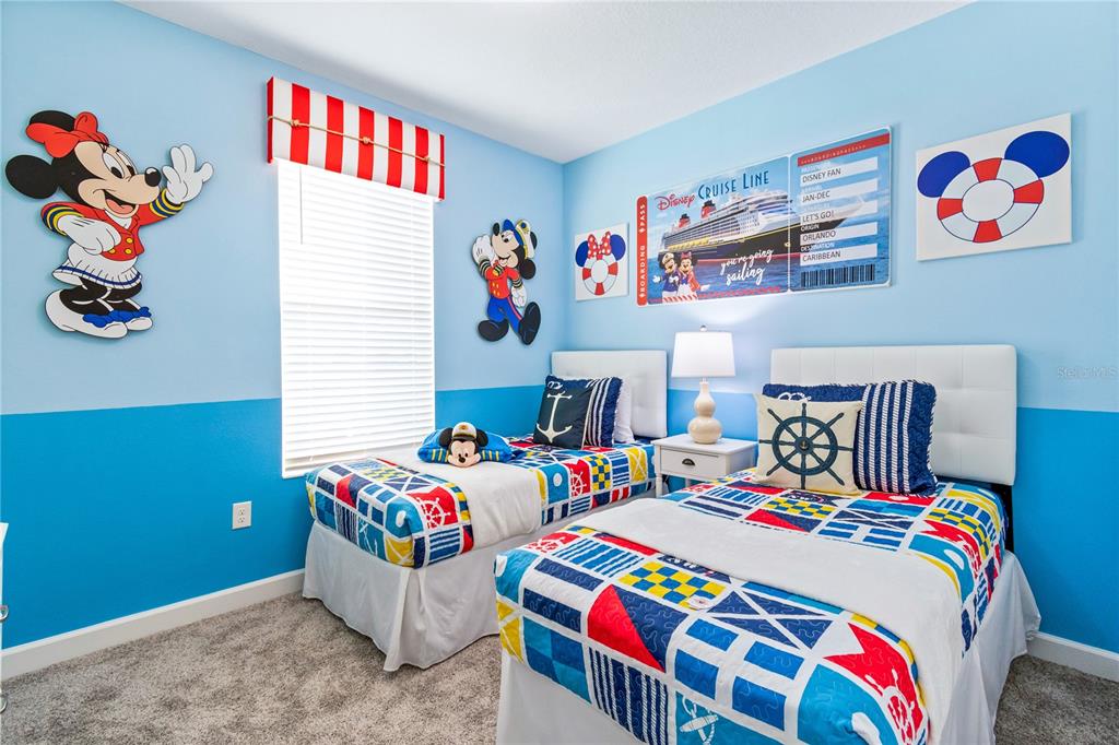 3032 Protagonist Street Kissimmee, FL 34746 - Photo 16 of 34 a bedroom with a bed and window