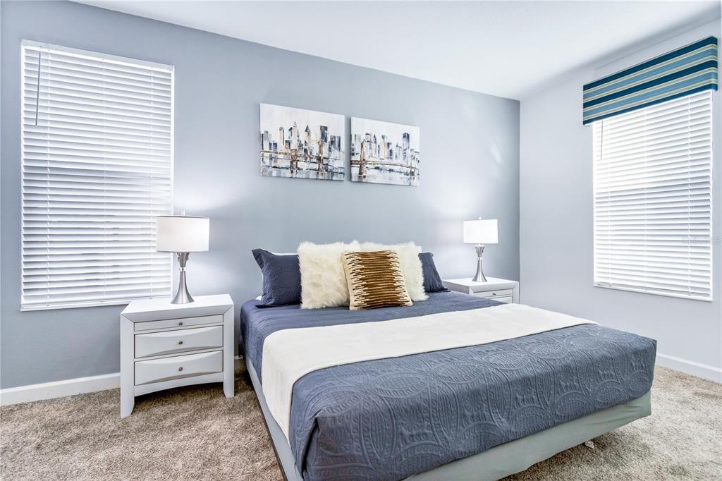 3032 Protagonist Street Kissimmee, FL 34746 - Photo 19 of 34 a bedroom with a bed and a window