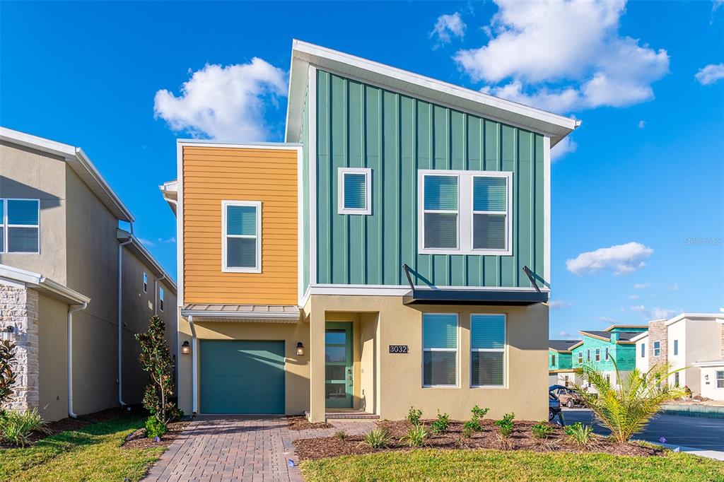 3032 Protagonist Street Kissimmee, FL 34746 - Photo 2 of 34 a front view of a house with a yard