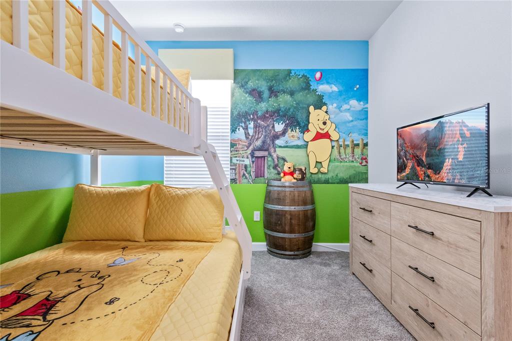 3032 Protagonist Street Kissimmee, FL 34746 - Photo 23 of 34 a living room with furniture and a flat screen tv