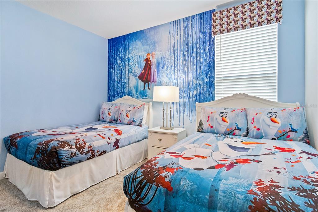 3032 Protagonist Street Kissimmee, FL 34746 - Photo 28 of 34 a bedroom with two beds and a window