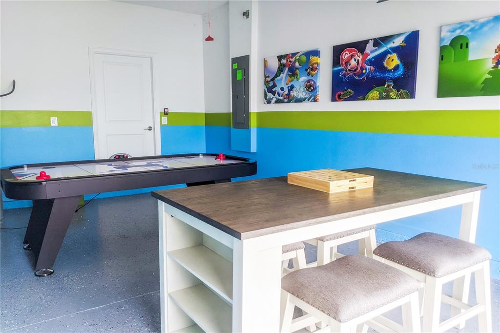 3032 Protagonist Street Kissimmee, FL 34746 - Photo 31 of 34 a view of a room with shelves and table