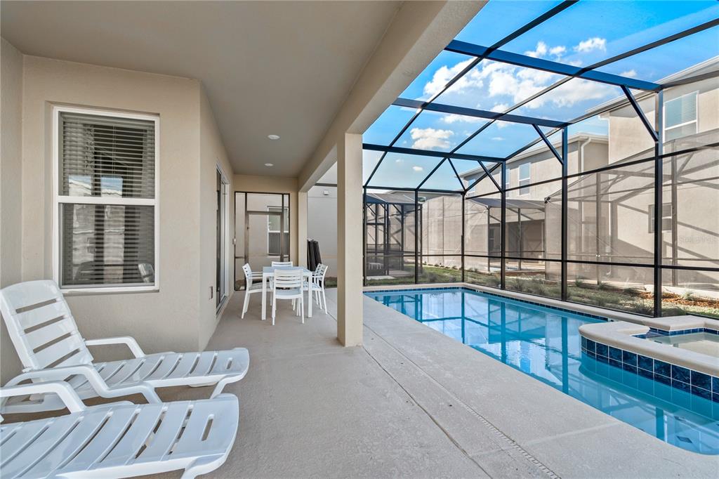 3032 Protagonist Street Kissimmee, FL 34746 - Photo 33 of 34 a living room with furniture and a large window