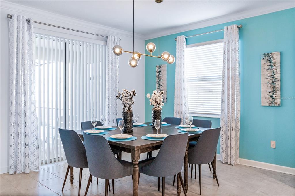 3032 Protagonist Street Kissimmee, FL 34746 - Photo 6 of 34 a view of a dining room with furniture and window