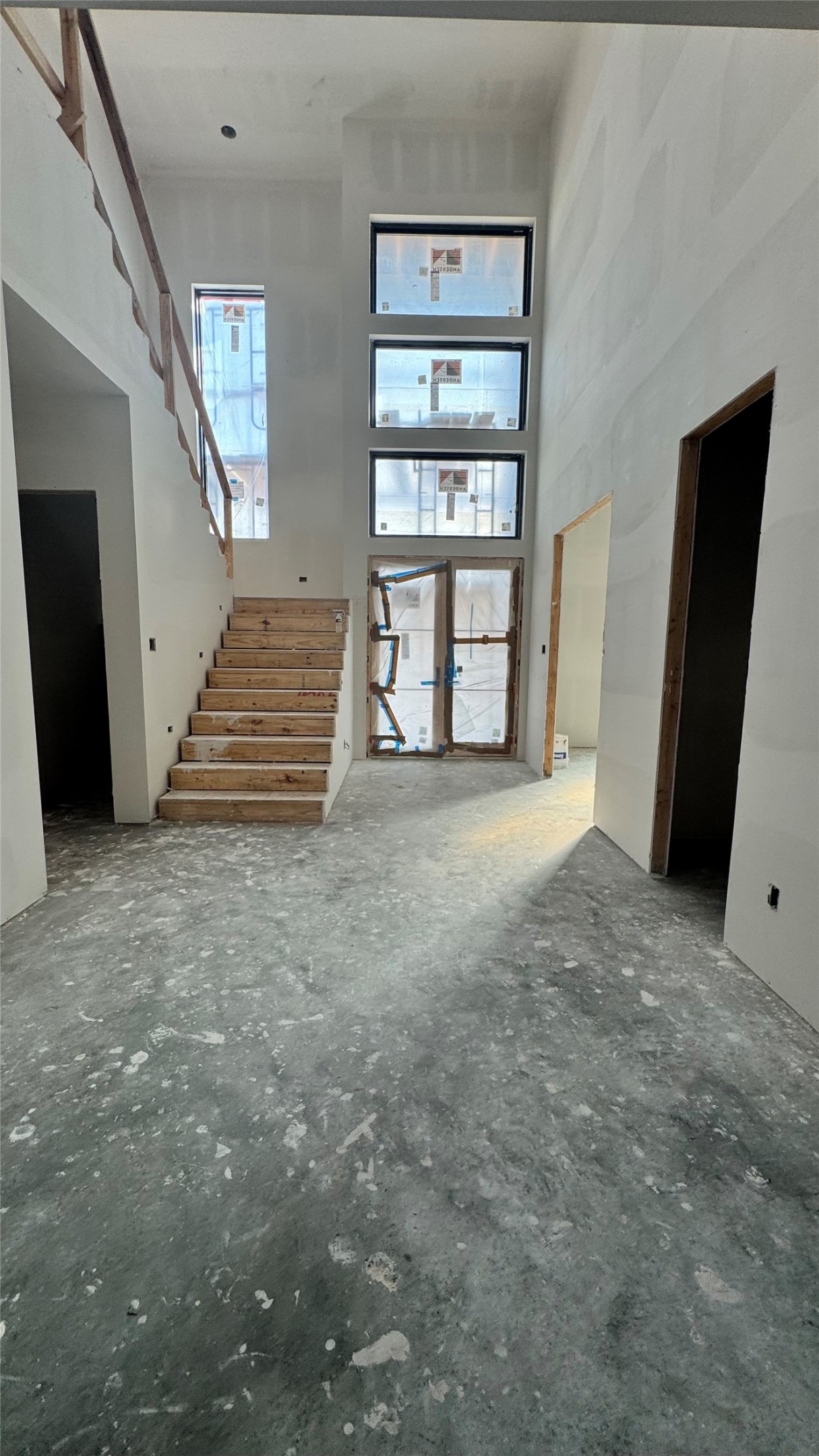 65 Shadow Creek Ridge Drive Spring, TX 77389 - Photo 23 of 35 a view of an empty room with wooden floor and stairs