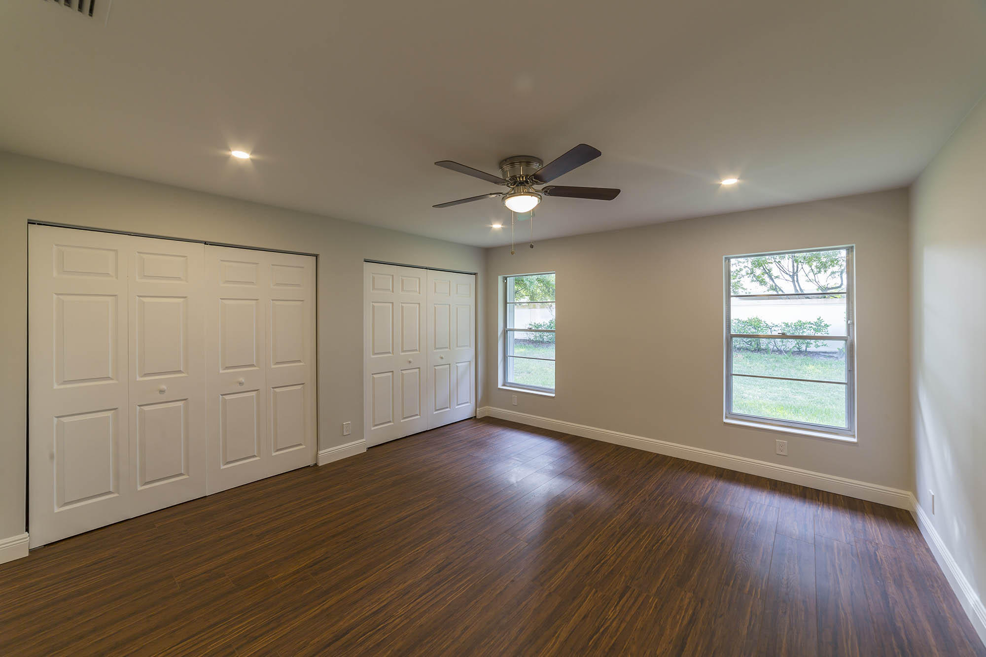 6337 Lasalle Road Delray Beach, FL 33484 - Photo 10 of 15 a view of an empty room with a window and wooden floor