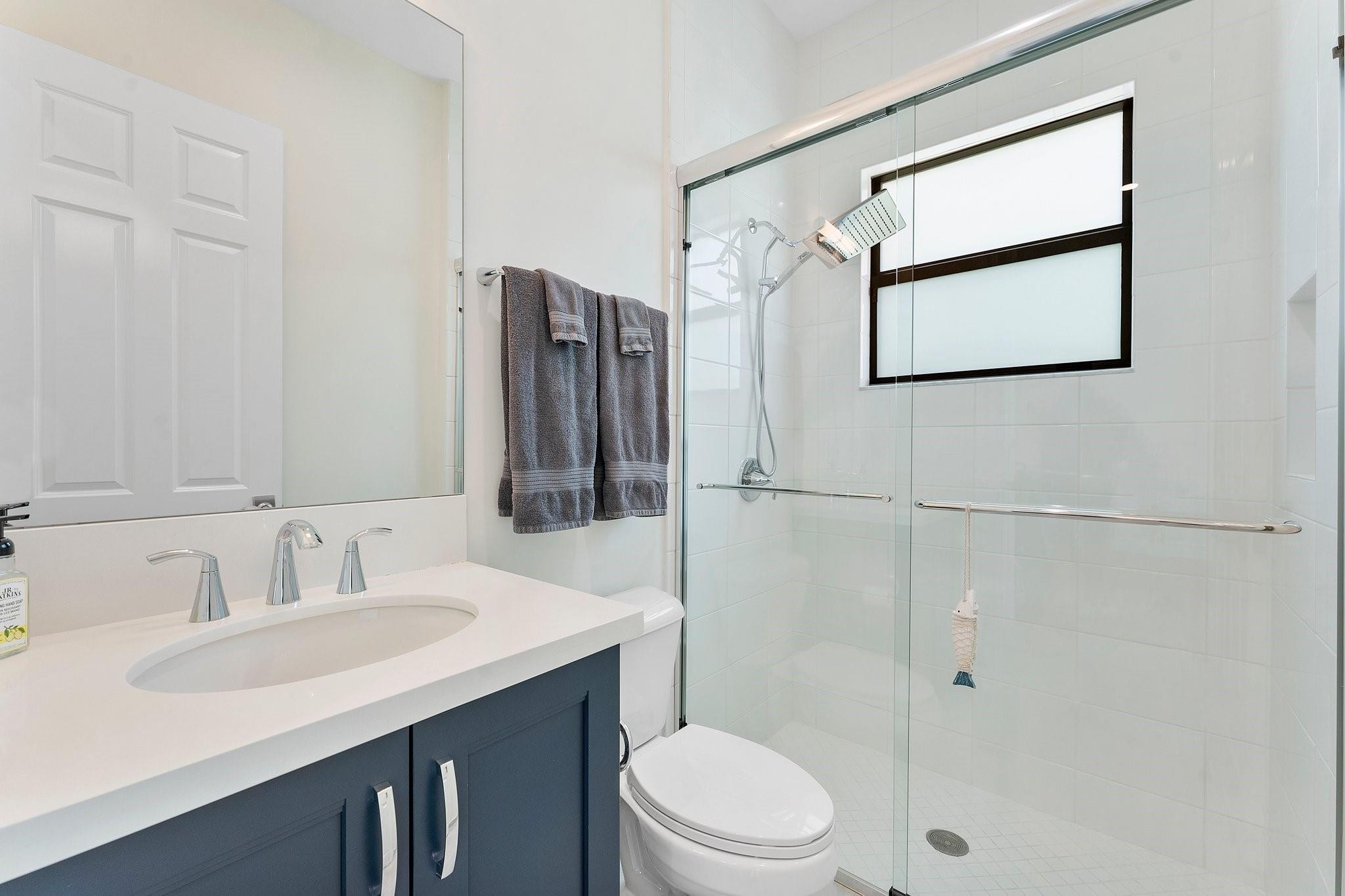 9626 Vescovato Way Boca Raton, FL 33496 - Photo 28 of 72 a bathroom with a sink toilet and shower