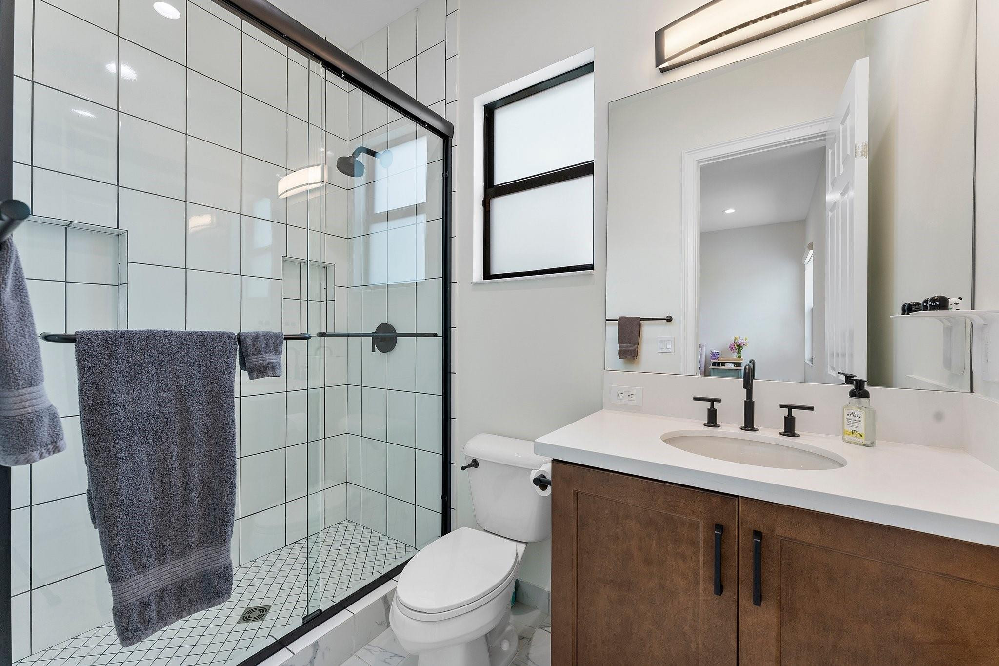 9626 Vescovato Way Boca Raton, FL 33496 - Photo 39 of 72 a bathroom with a sink a toilet and shower