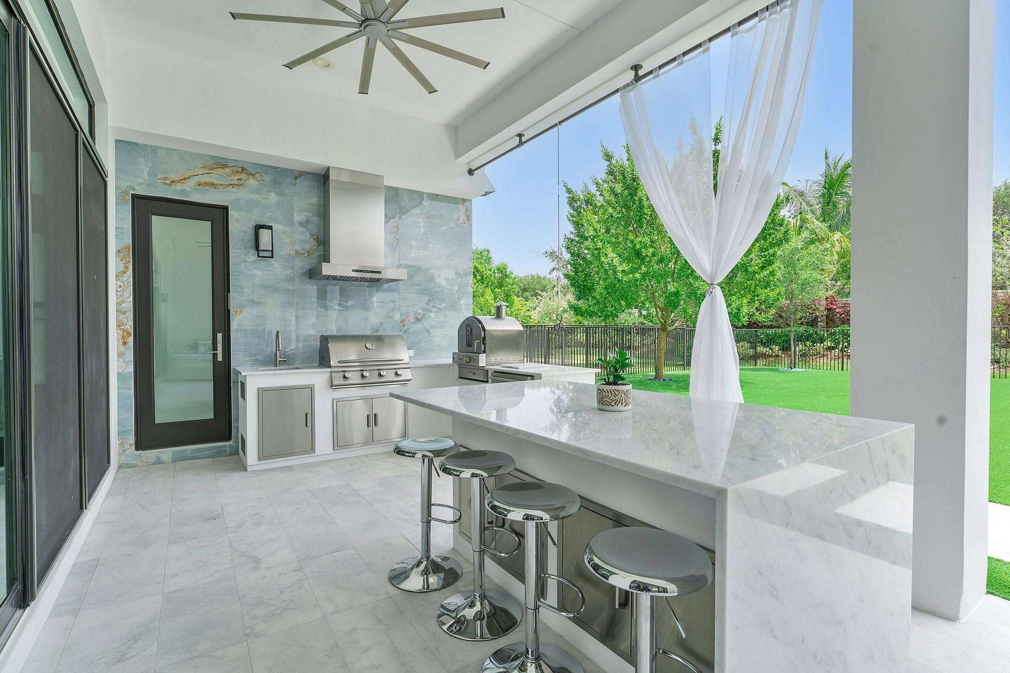 9626 Vescovato Way Boca Raton, FL 33496 - Photo 50 of 72 a kitchen with a table and chairs