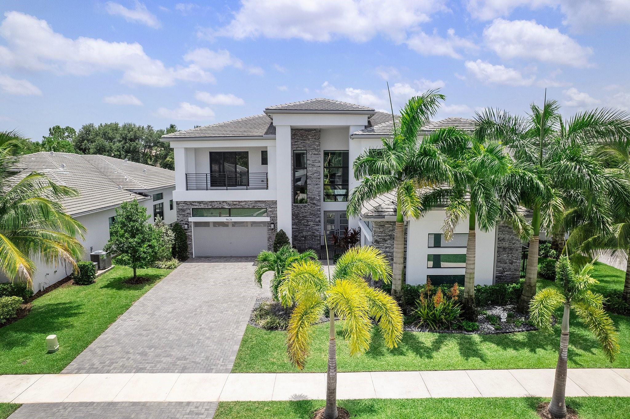 9626 Vescovato Way Boca Raton, FL 33496 - Photo 5 of 72 a front view of a house with a garden