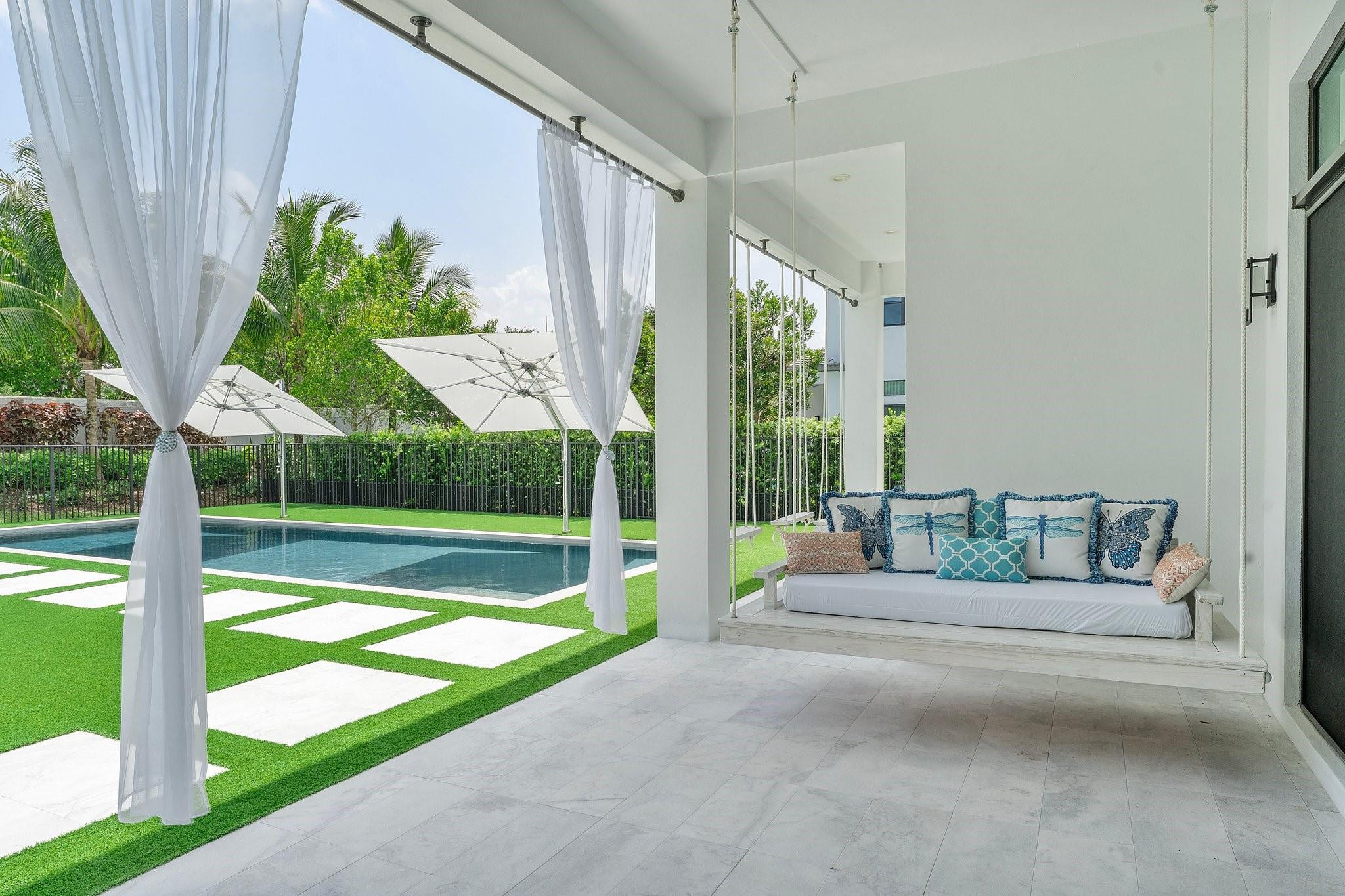 9626 Vescovato Way Boca Raton, FL 33496 - Photo 57 of 72 a view of backyard with swimming pool and outdoor seating