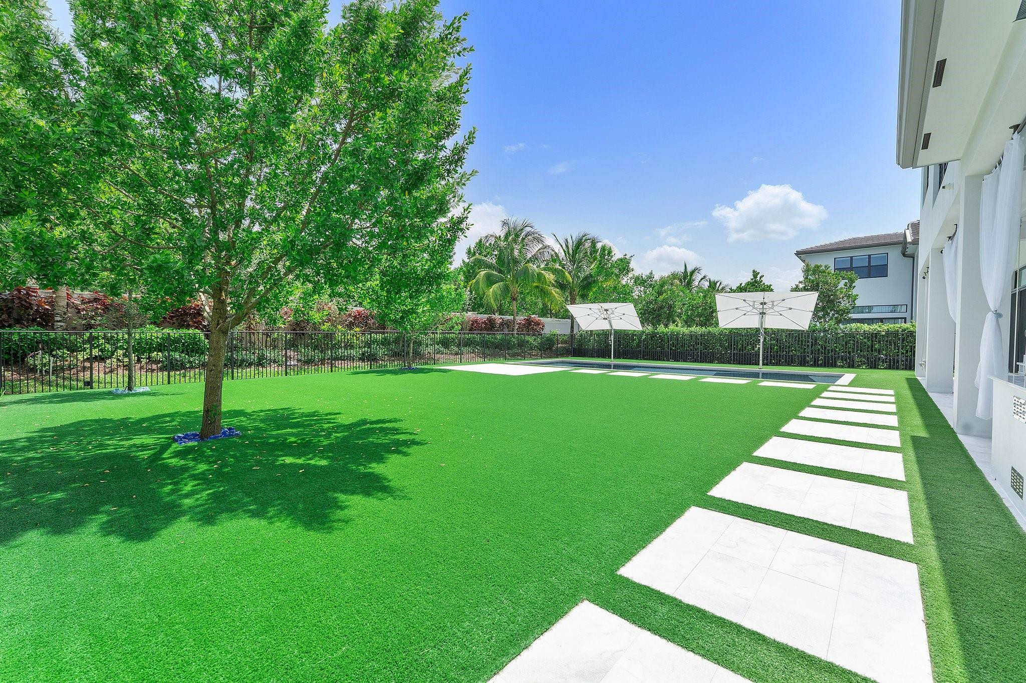 9626 Vescovato Way Boca Raton, FL 33496 - Photo 58 of 72 a front view of a house with a yard