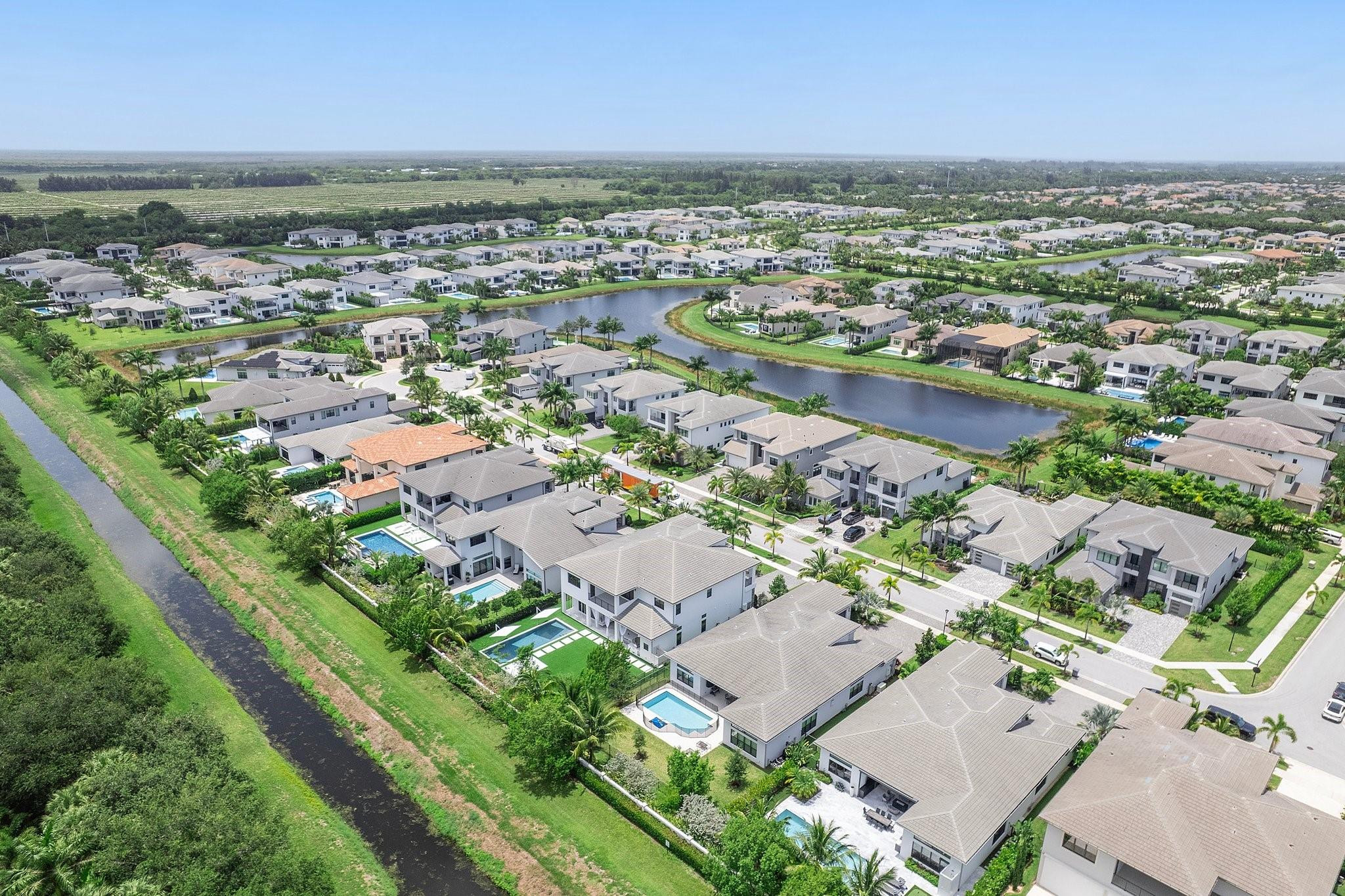 9626 Vescovato Way Boca Raton, FL 33496 - Photo 63 of 72 an aerial view of a city with lots of residential buildings and ocean view in back
