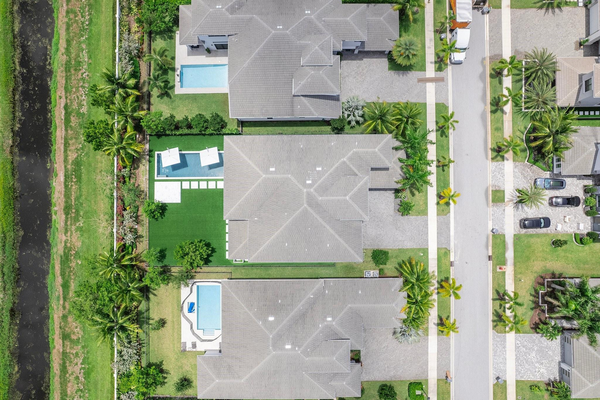 9626 Vescovato Way Boca Raton, FL 33496 - Photo 65 of 72 an aerial view of a house with a yard and garden