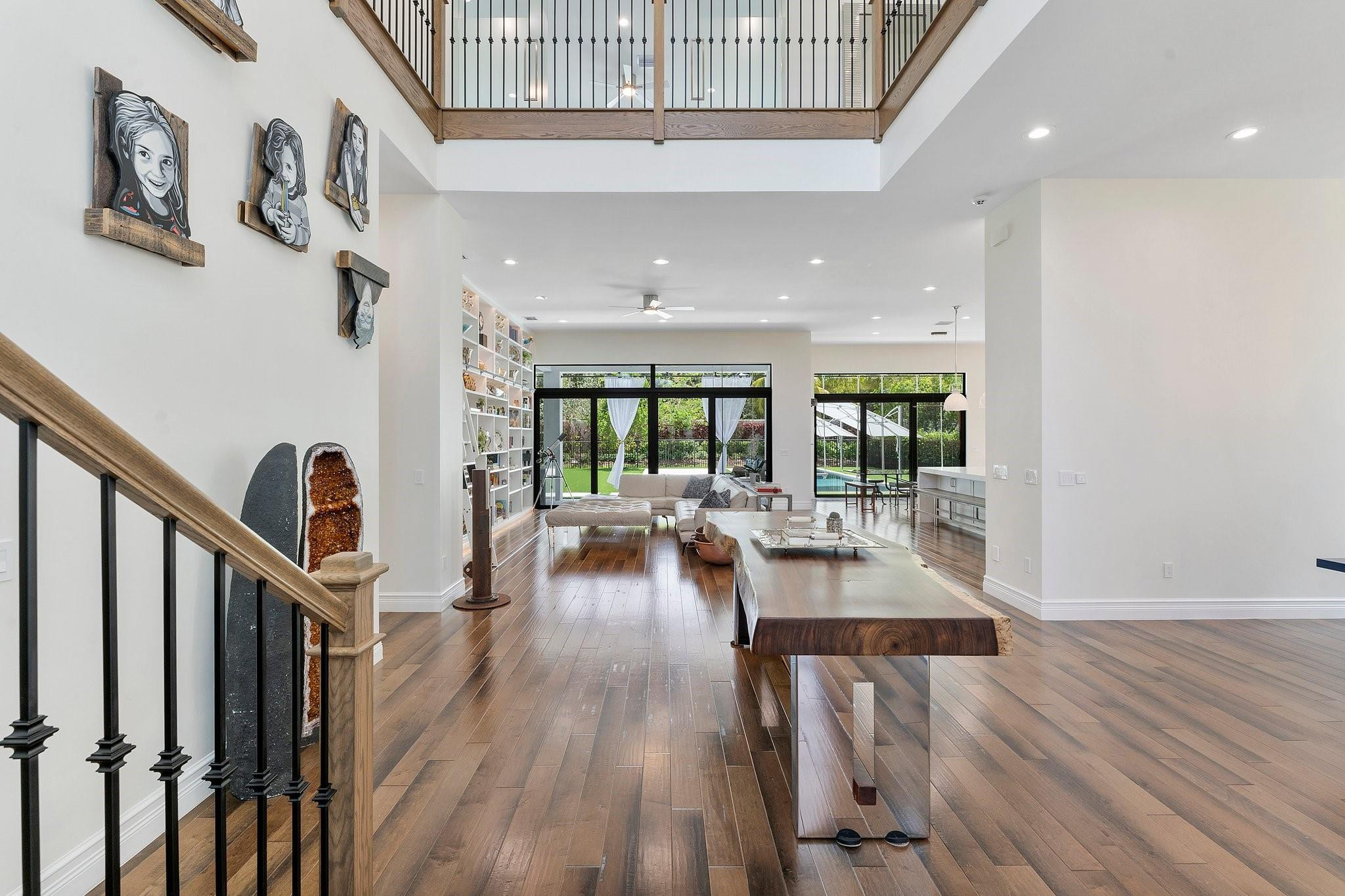 9626 Vescovato Way Boca Raton, FL 33496 - Photo 10 of 72 a view of a living room and dining room with wooden floor