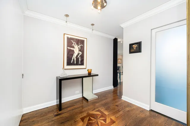 a view of an entryway with wooden floor