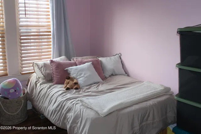 a room with furniture and wooden floor