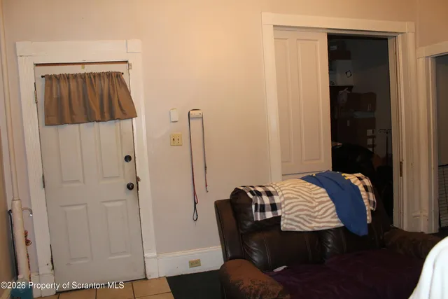 a close view of shoes and a dining table with chairs