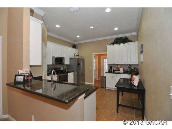 4952 Southwest 91st Way Gainesville, FL 32608 - Photo 6 of 24 Kitchen w/ Breakfast Bar