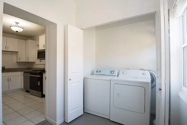 a view of a storage & utility room with washer and dryer