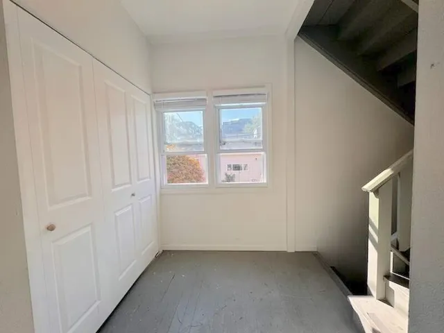 a view of an empty room with a window