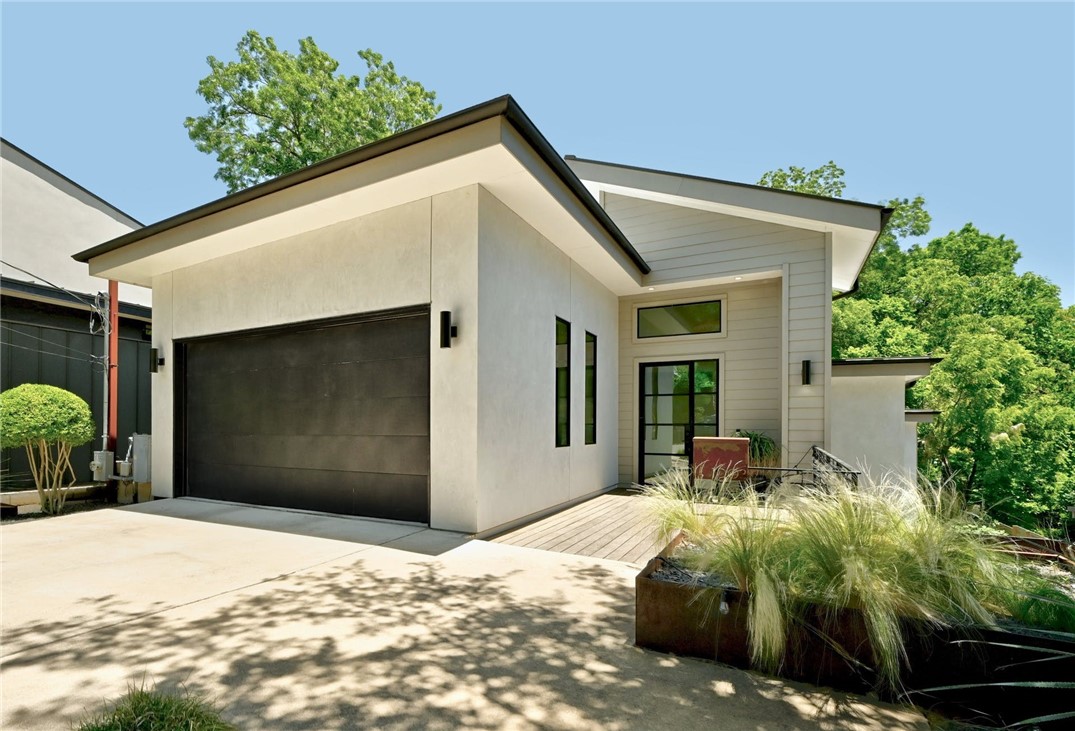 1003 South 3rd Street Austin, TX 78704 - Photo 1 of 1 a front view of a house with a yard