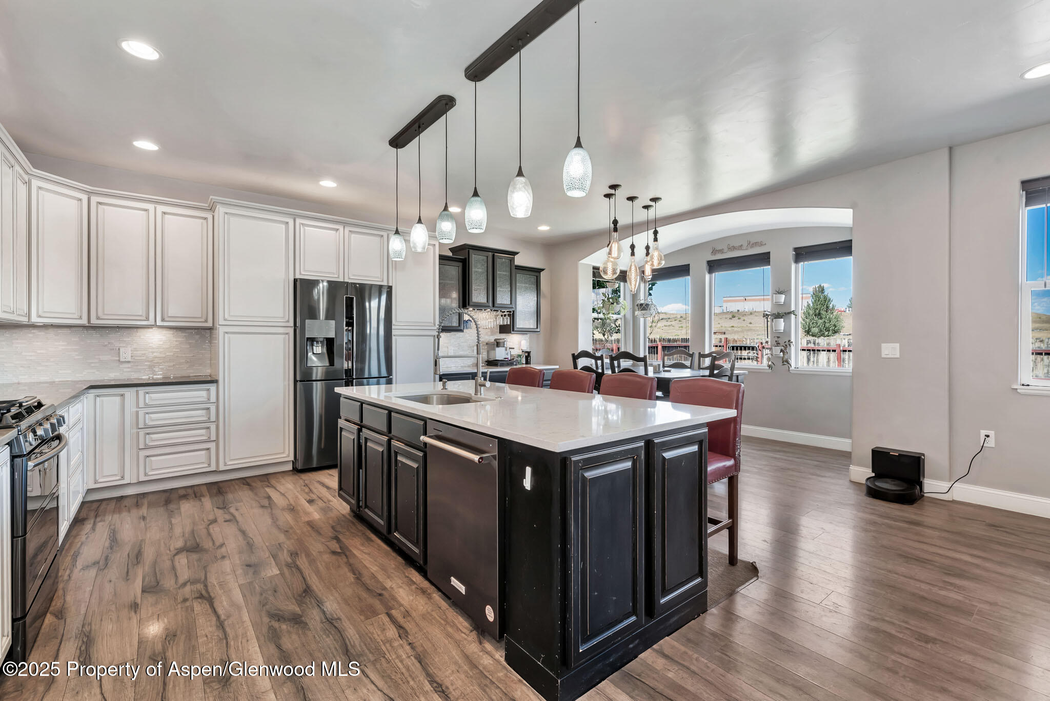 875 Dry Creek Road Hayden, CO 81639 - Photo 7 of 40 a kitchen with stainless steel appliances granite countertop a sink a stove and a refrigerator