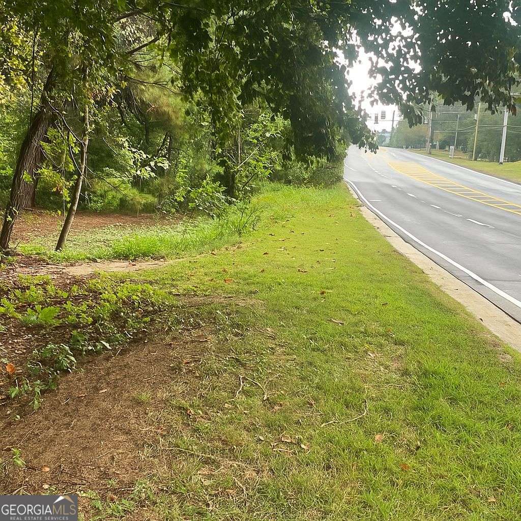 5160 Covington Highway, Unit 18 Decatur, GA 30035 - Photo 7 of 8 a view of a yard with a tree