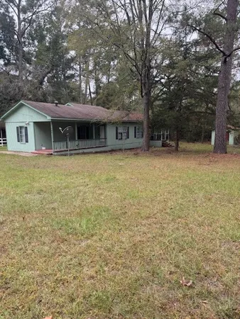 a front view of a house with yard