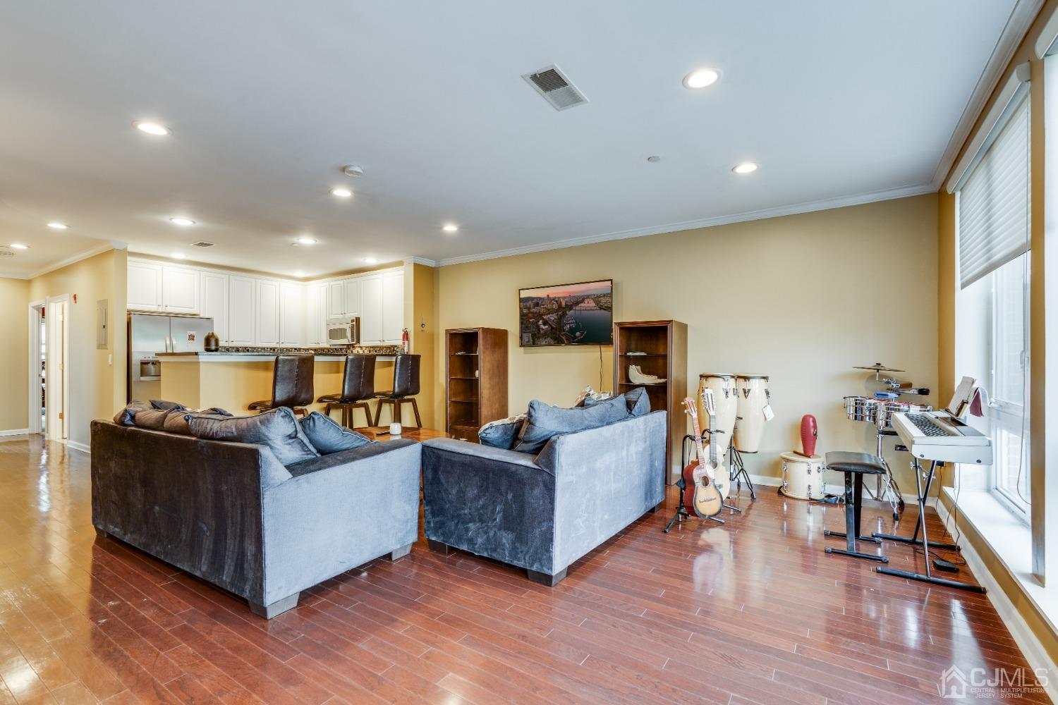 368 Rector Street, Unit 418 Perth Amboy, NJ 08861 - Photo 3 of 48 a living room with furniture and a flat screen tv