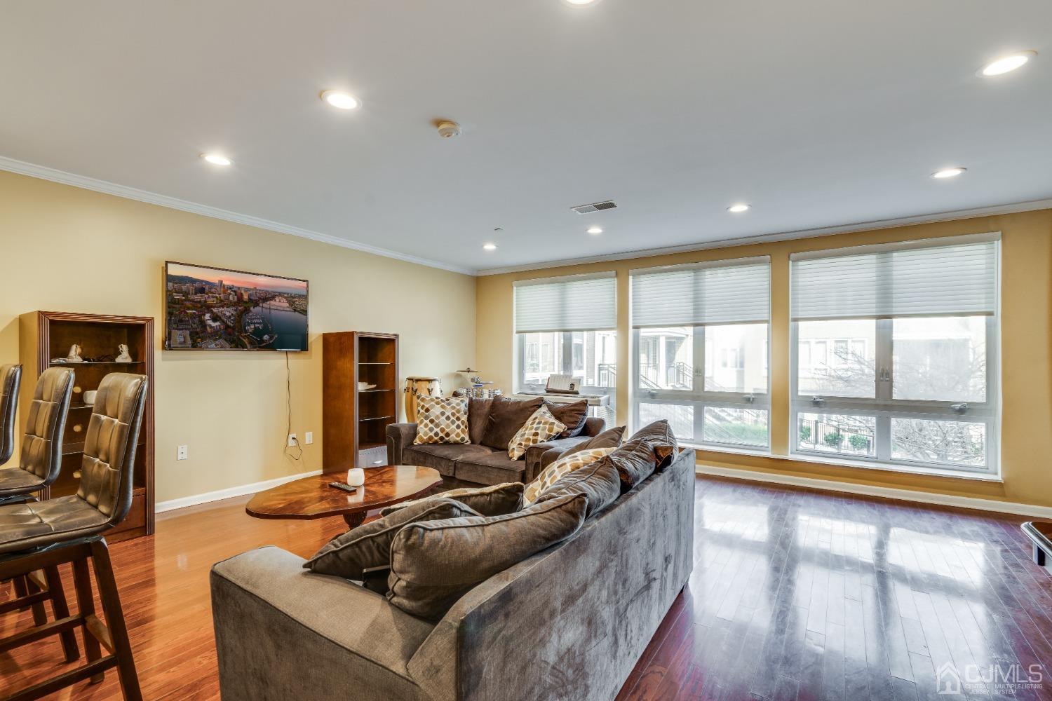 368 Rector Street, Unit 418 Perth Amboy, NJ 08861 - Photo 4 of 48 a living room with furniture and a flat screen tv