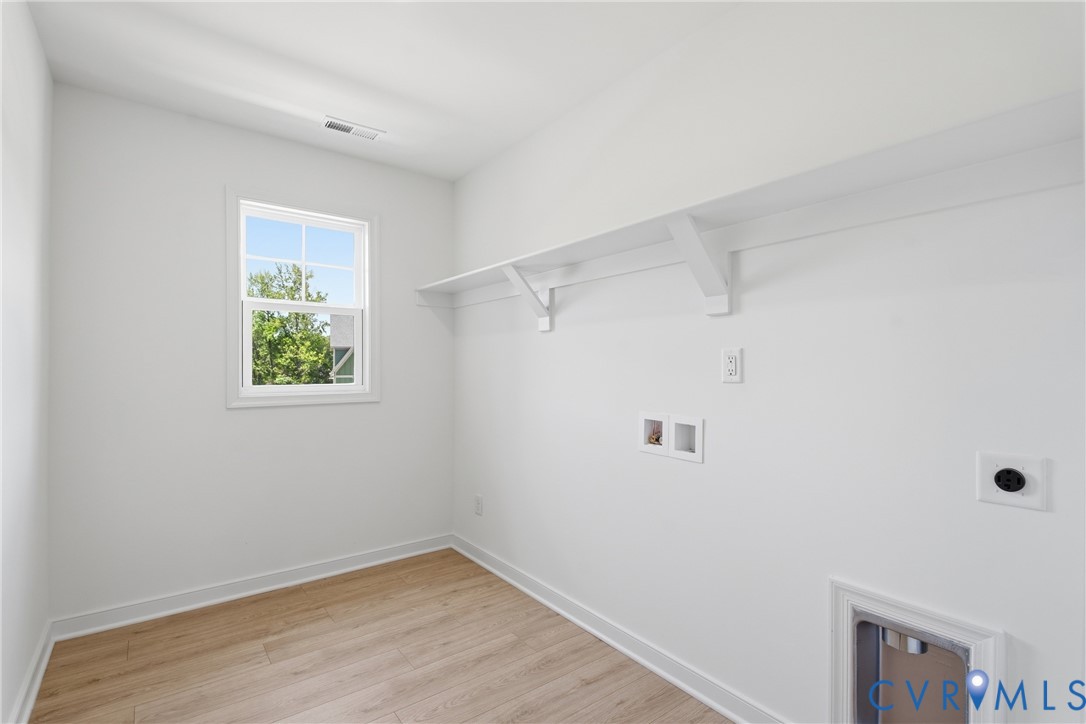 4013 Robins Ridge Drive Moseley, VA 23120 - Photo 24 of 33 2nd floor laundry room
