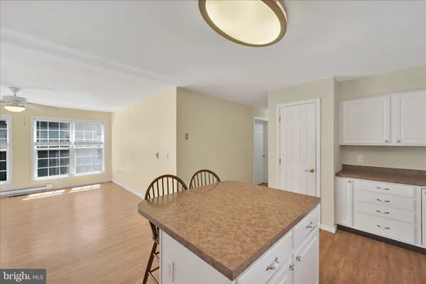 a view of a kitchen with a sink cabinets and a window