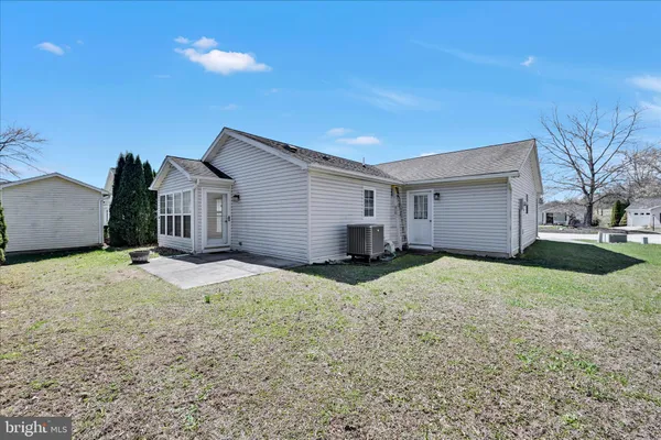 a house view with a backyard space
