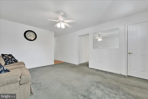 a view of an empty room with a fan
