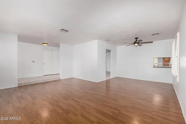 a view of a dining room with furniture and window