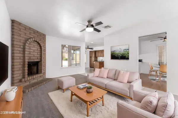 a view of an empty room with a fireplace