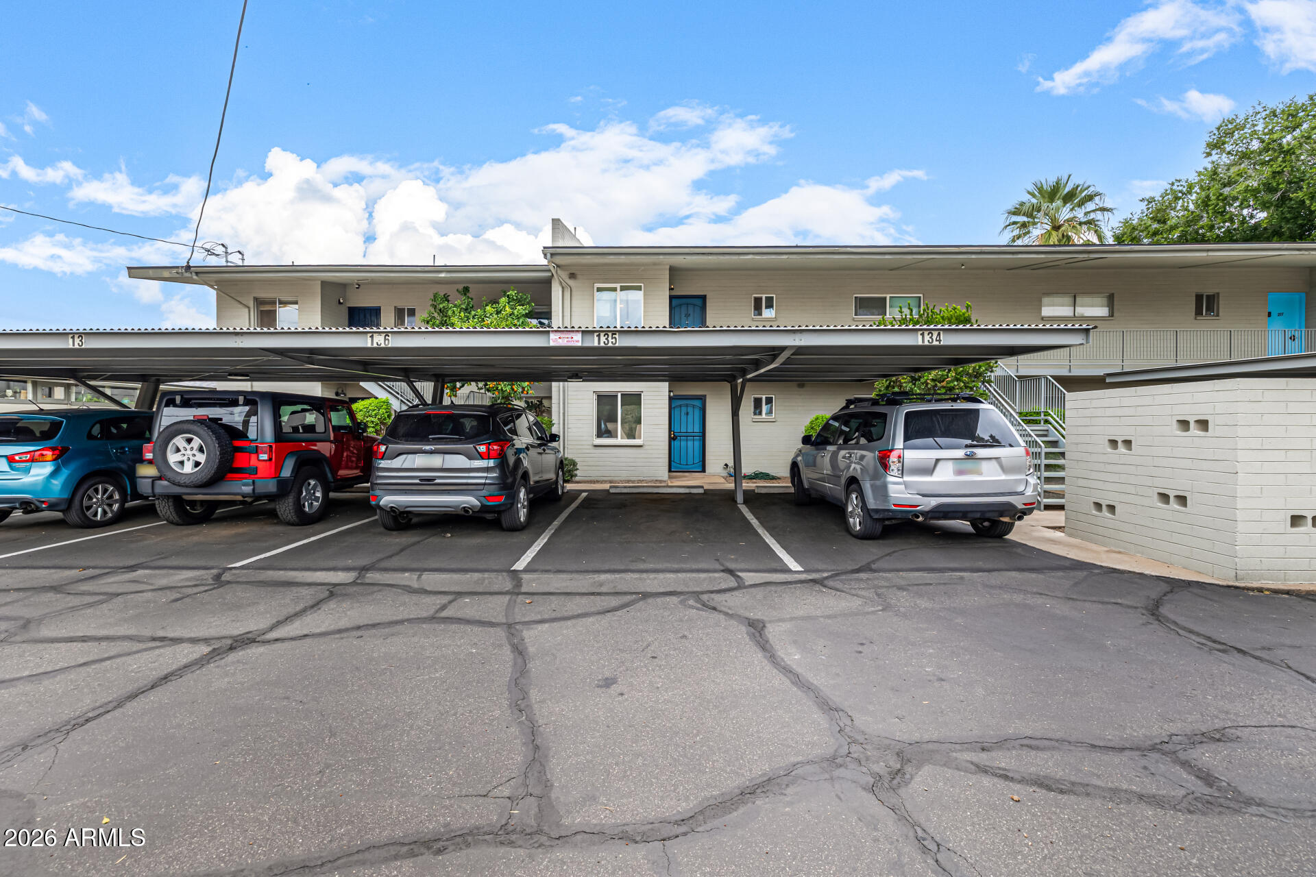 1107 West Osborn Road, Unit 118 Phoenix, AZ 85013 - Photo 16 of 18 a car parked in the parking lot