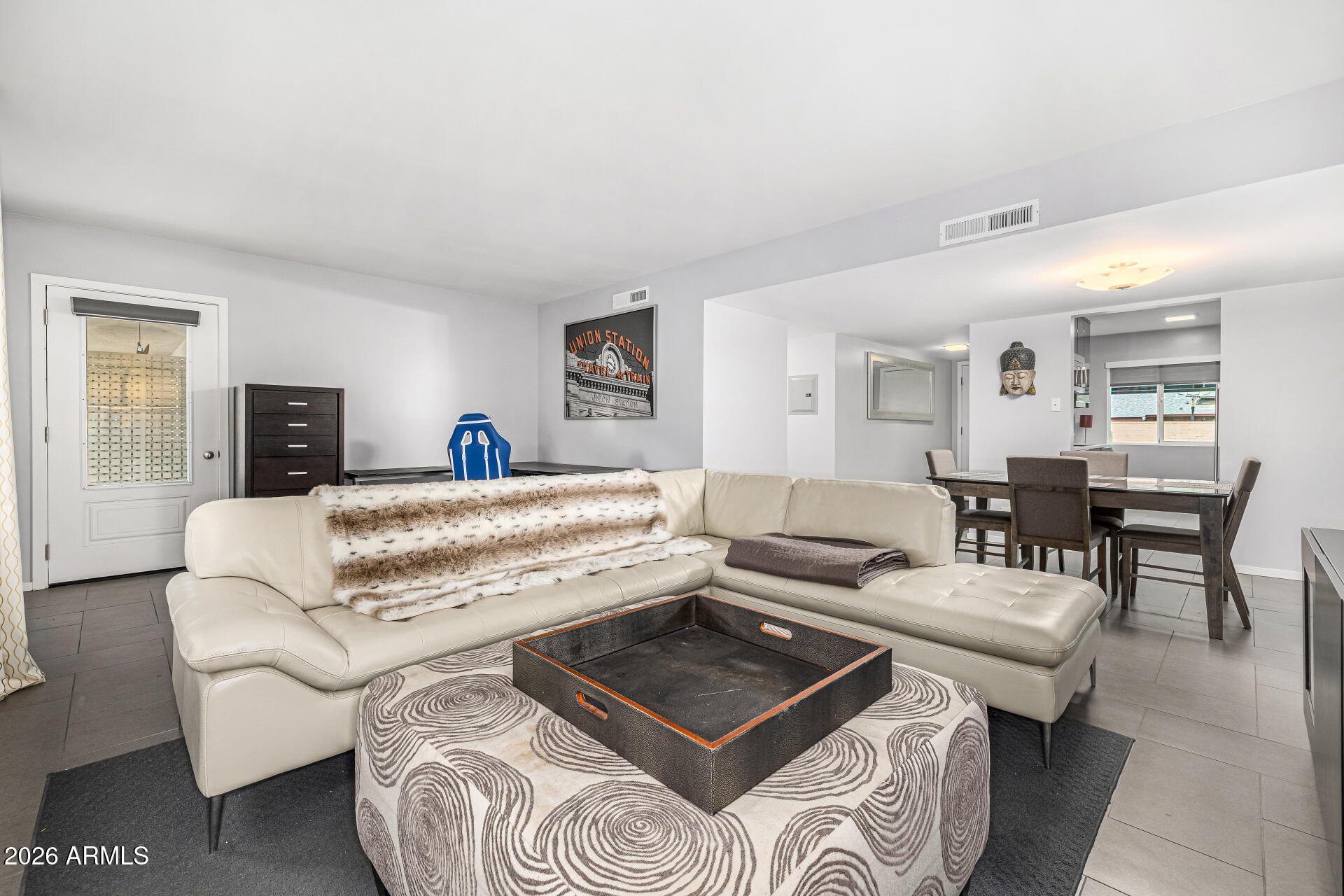 1107 West Osborn Road, Unit 118 Phoenix, AZ 85013 - Photo 4 of 18 a living room with furniture and a couch