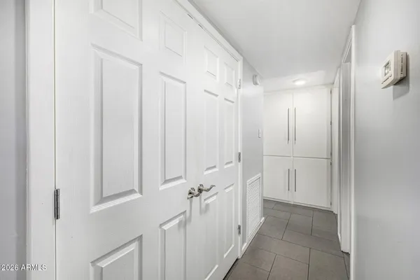 a bedroom with a bed and a closet