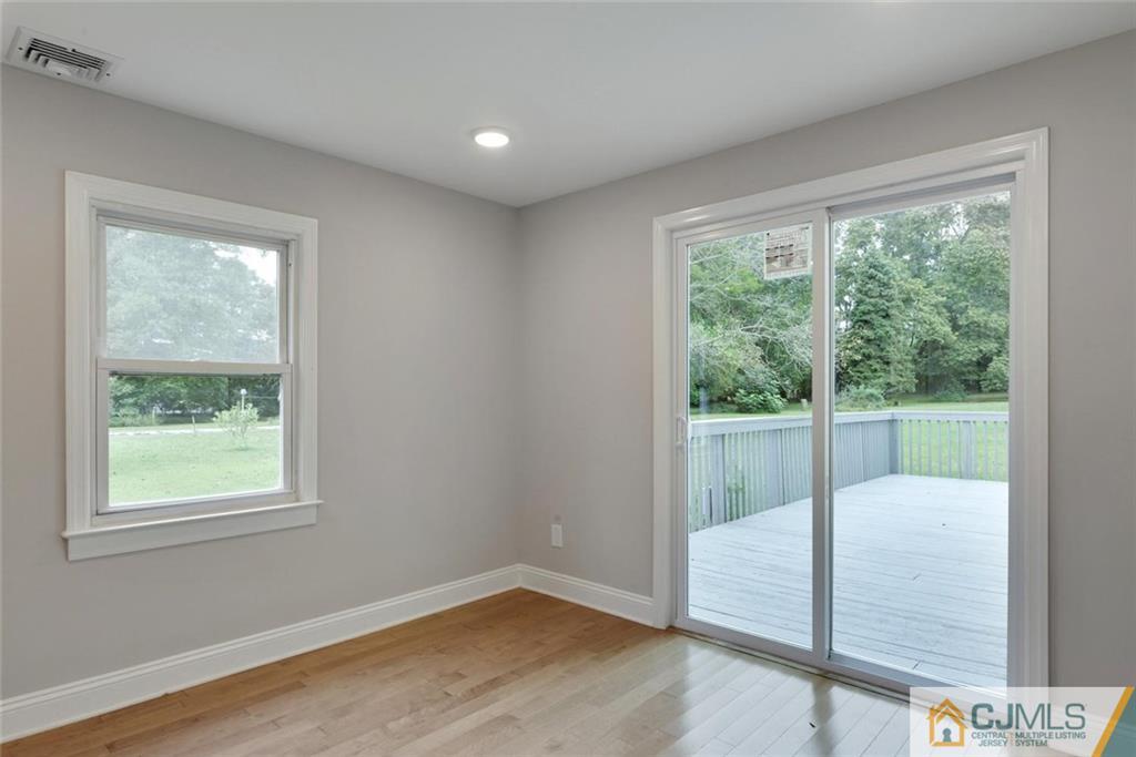 18 Old Ridge Road Monmouth Junction, NJ 08852 - Photo 13 of 25 a view of a room with wooden floor and a window