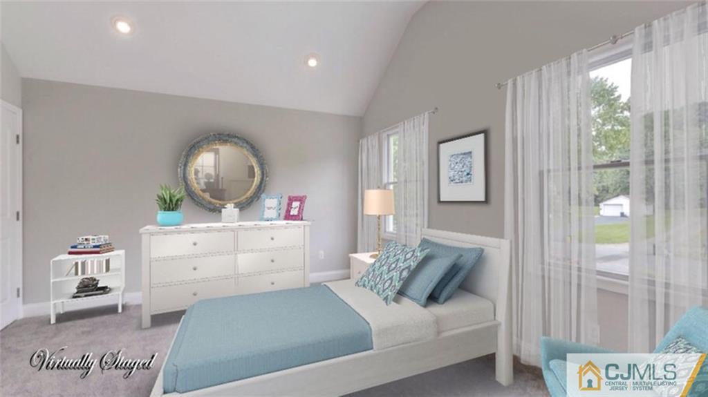 18 Old Ridge Road Monmouth Junction, NJ 08852 - Photo 19 of 25 a view of a bedroom with a bed and a mirror
