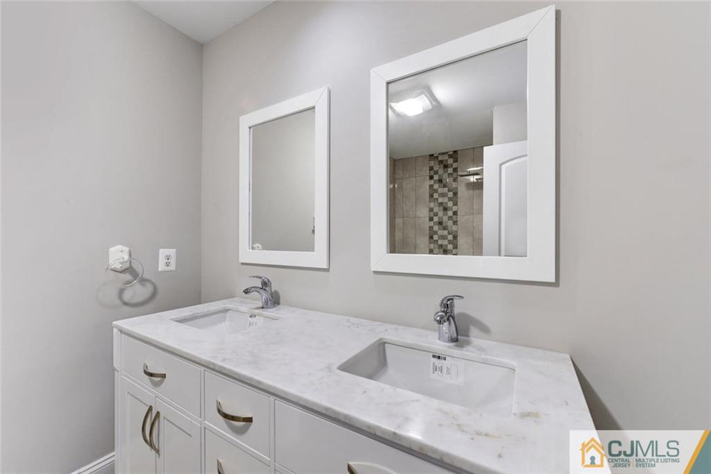 18 Old Ridge Road Monmouth Junction, NJ 08852 - Photo 20 of 25 a bathroom with a sink and a mirror