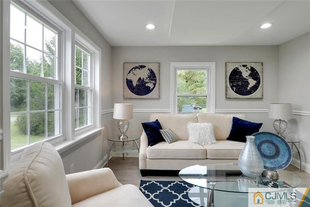 18 Old Ridge Road Monmouth Junction, NJ 08852 - Photo 3 of 25 a living room with furniture and a large window