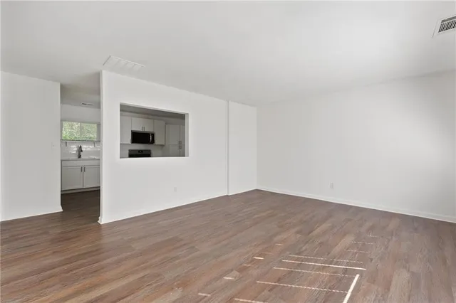a view of a livingroom with wooden floor