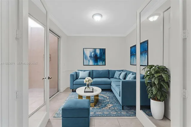 a living room with furniture and a potted plant