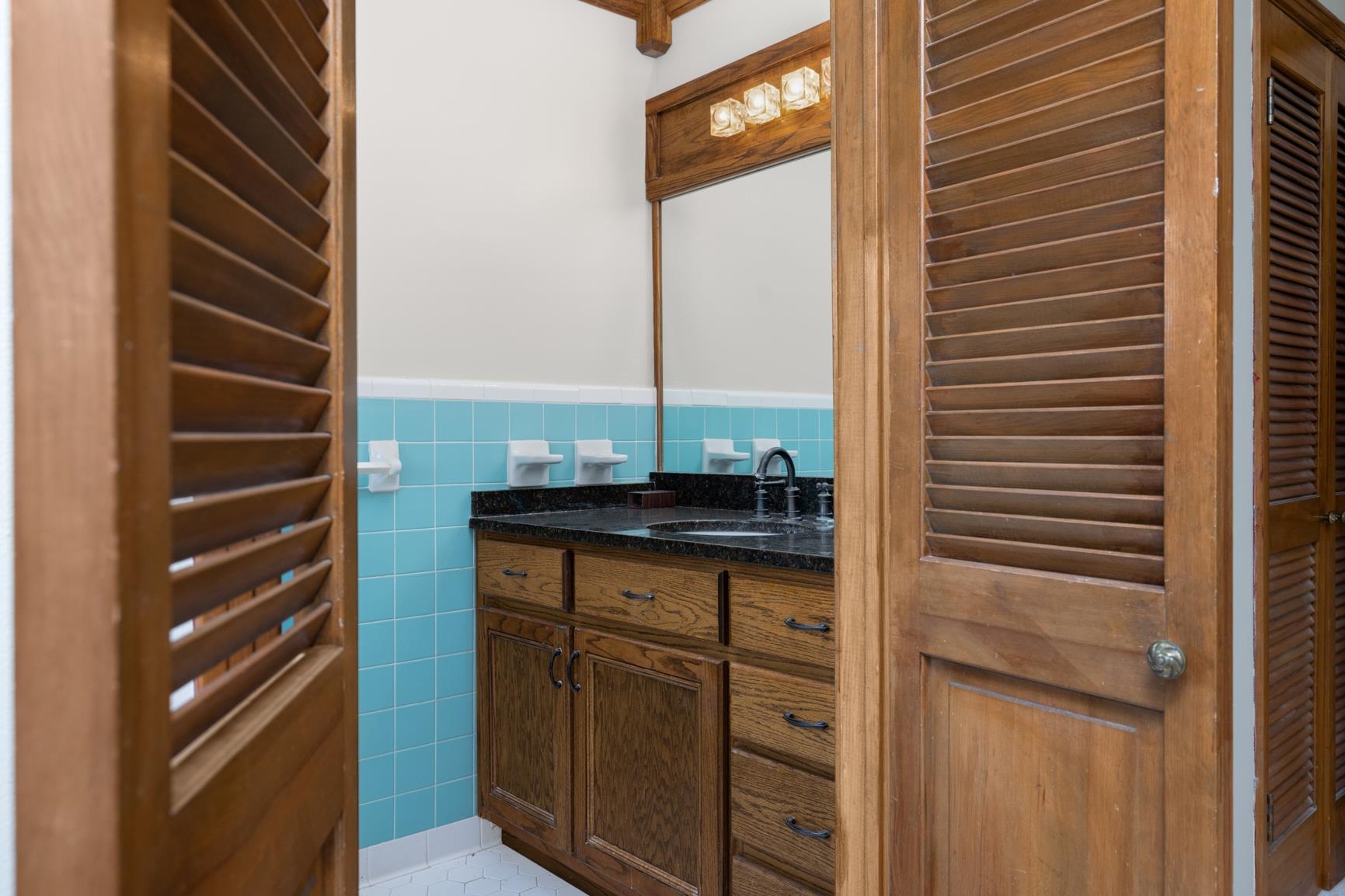 2930 Indian Creek Road Brighton, TN 38011 - Photo 16 of 39 a bathroom with a granite countertop sink and a mirror
