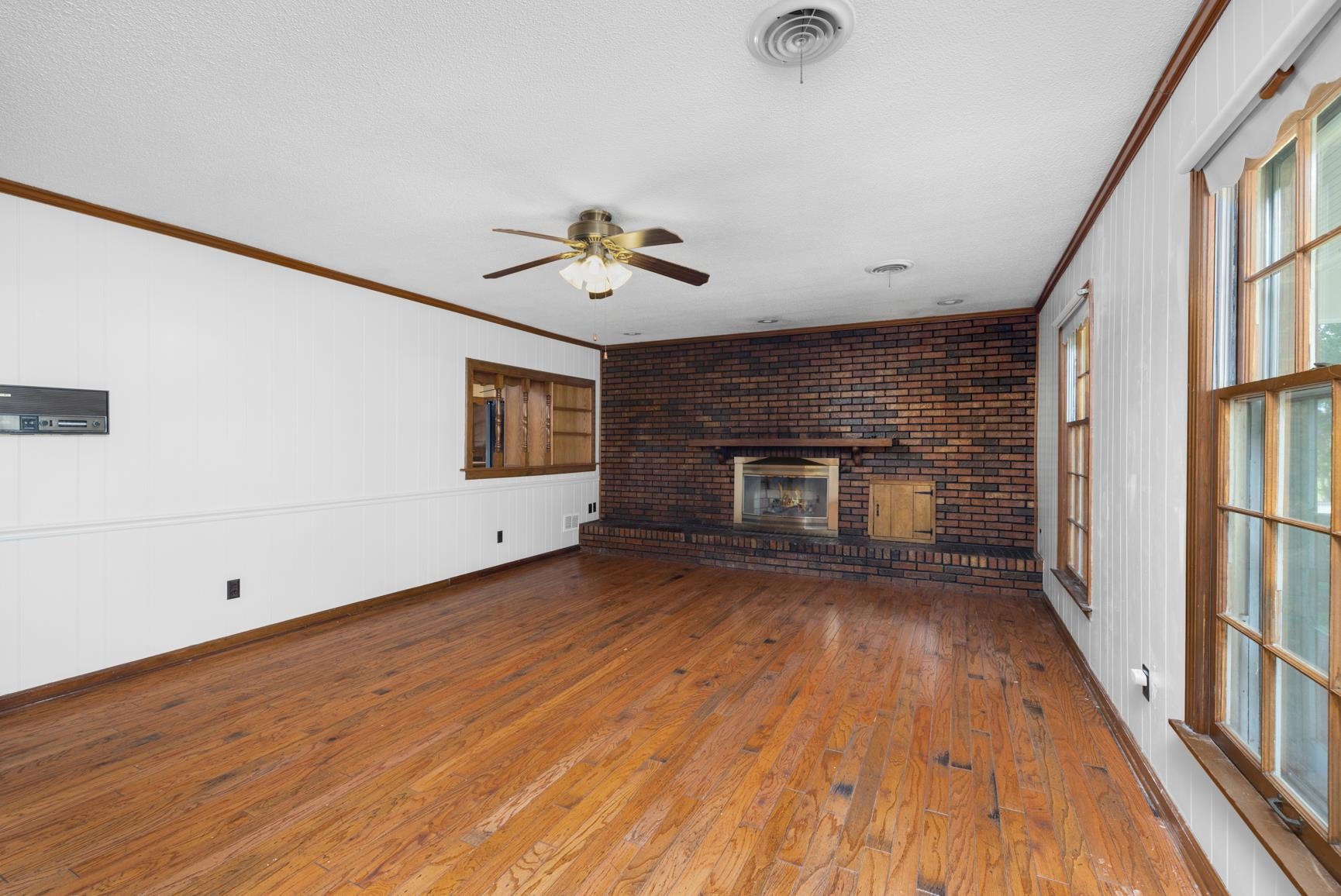 2930 Indian Creek Road Brighton, TN 38011 - Photo 7 of 39 a view of a room with wooden floor and fireplace